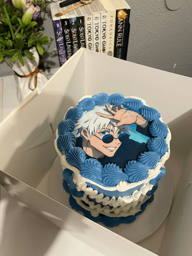 3D anime cake for boy showing Goku from Dragon Ball Z with blue and orange frosting