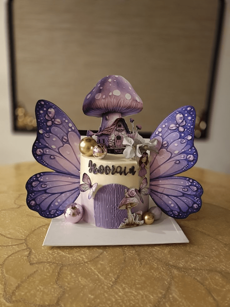 Fantasy-themed cake featuring glittering butterflies, flowers, and dreamlike details
